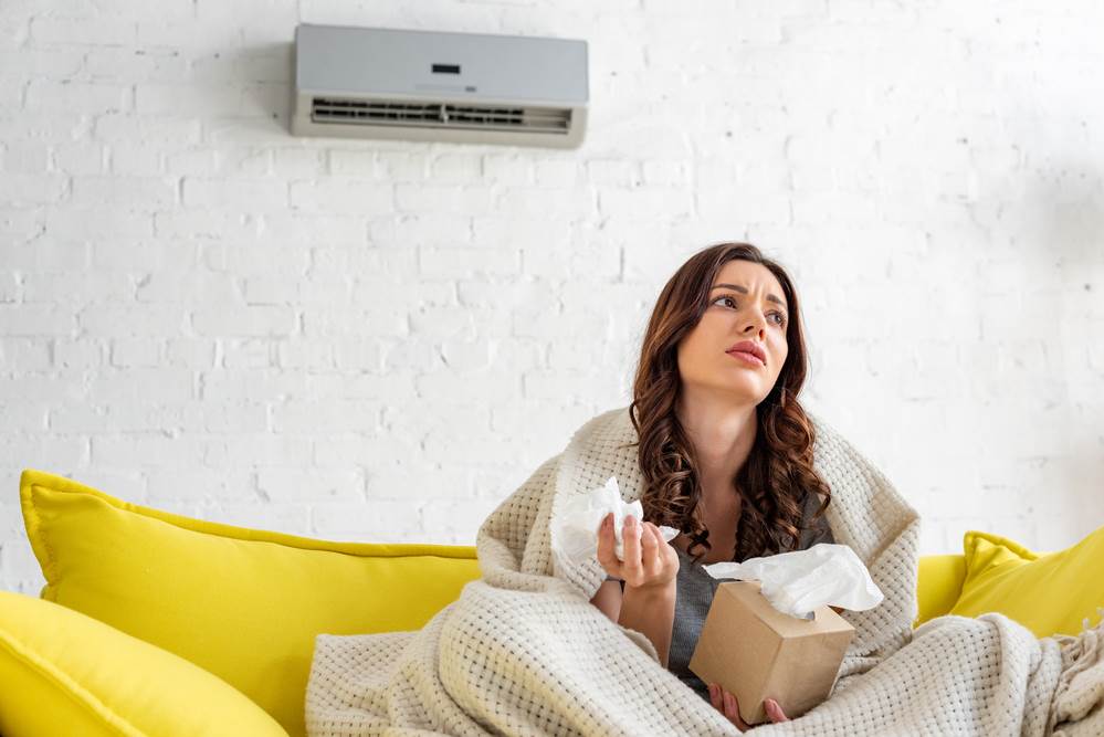 woman ill from her HVAC not functioning properly